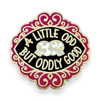 Pin with 'A Little Odd But Oddly Good' text and skull design on a white background