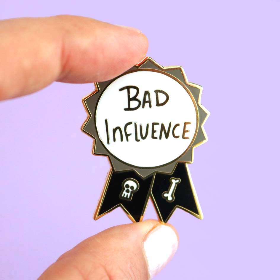 Bad Influence Lapel Pin held by fingers
