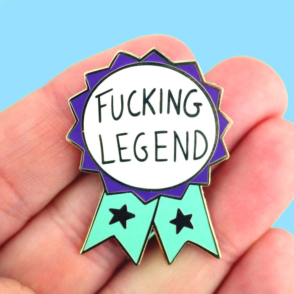 Fucking Legend Lapel Pin in hand