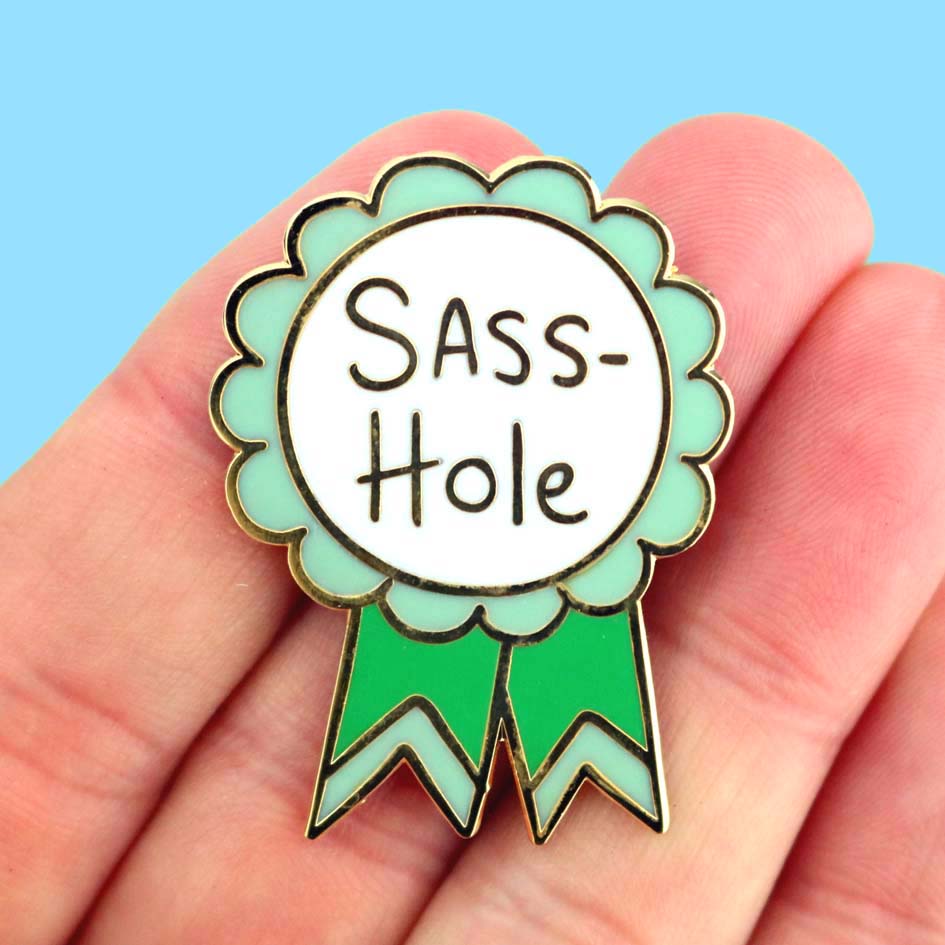 Sass-Hole Lapel Pin in hand